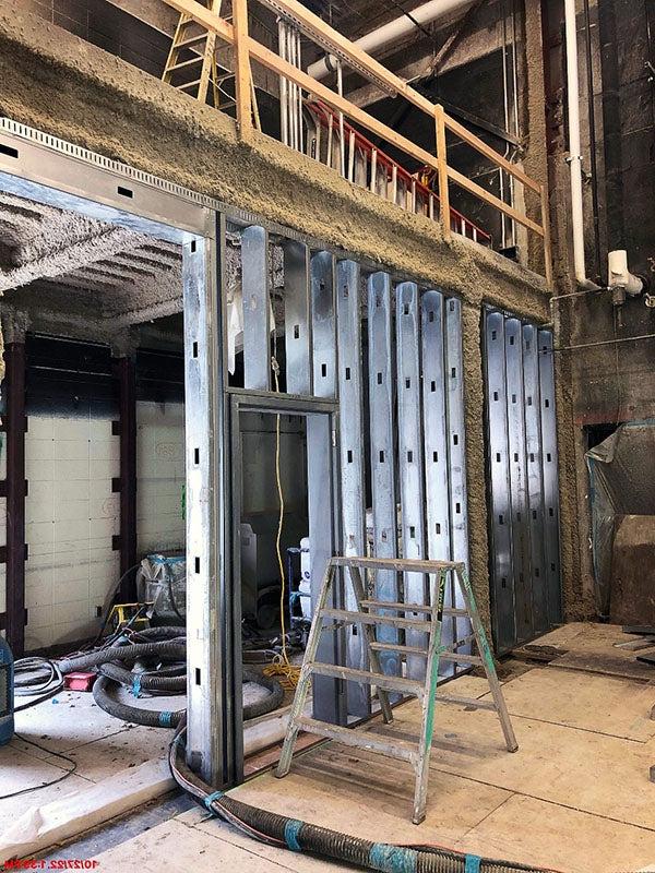 metal framing below a balcony under construction